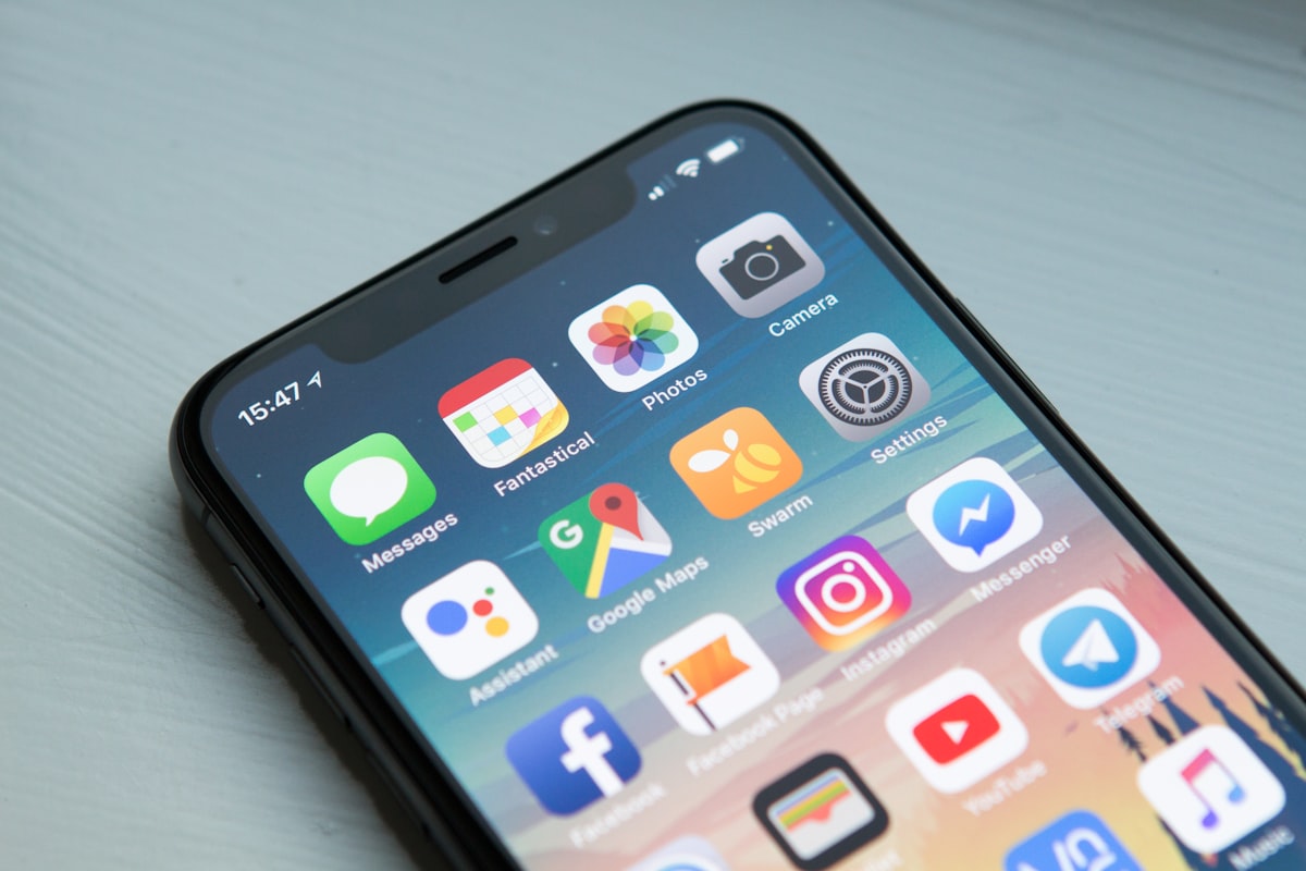 Smartphone showing mobile app icons — illustrating Flutter app development cost